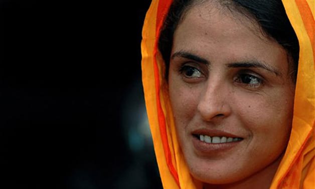 **FILE** In this June 29, 2005 file photo, Pakistani gang-rape victim Mukhtar Mai speaks to the Associated Press in Islamabad, Pakistan. Mai, who gained global fame by speaking out about her case, has defied another local taboo by getting married. Mai is now the second wife of Nasir Abbas Gabol, a police officer who has helped protect her. Gabol told the AP on Wednesday, March 18, 2009 that he was enraptured by Mai's "extreme courage."(AP Photo/Anjum Naveed,File)